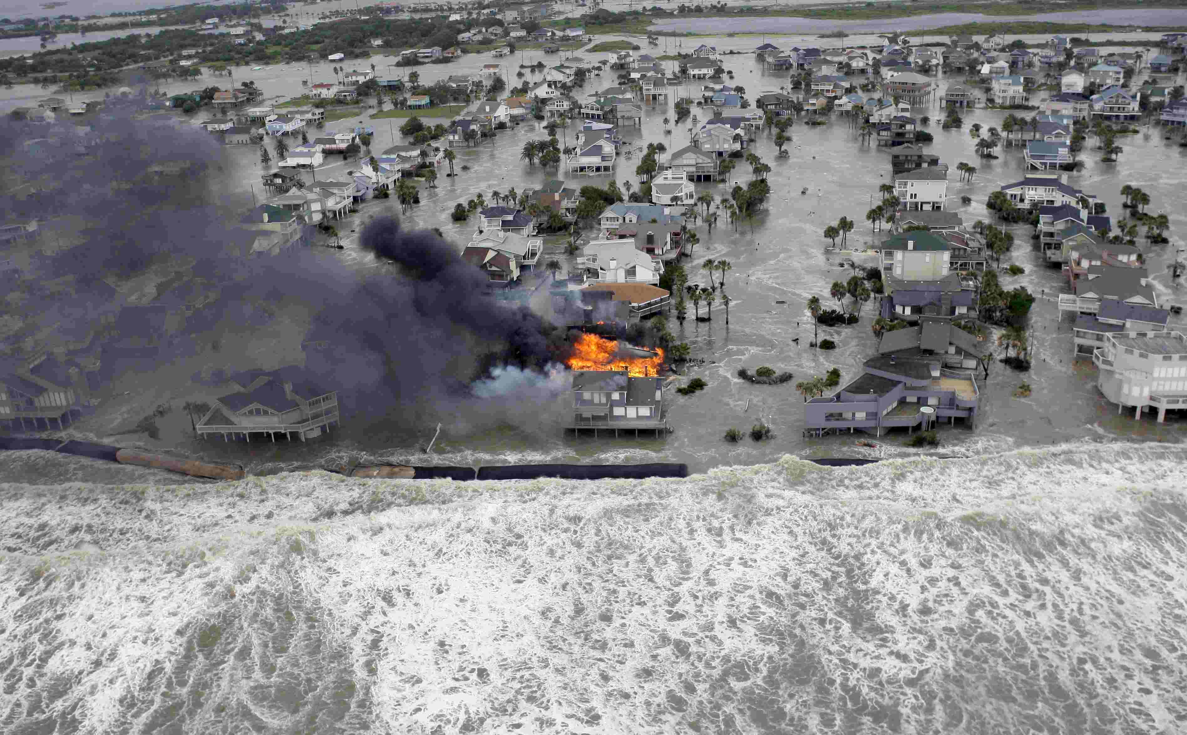 Fire destroying homes along the beach on Galveston Island, Texas