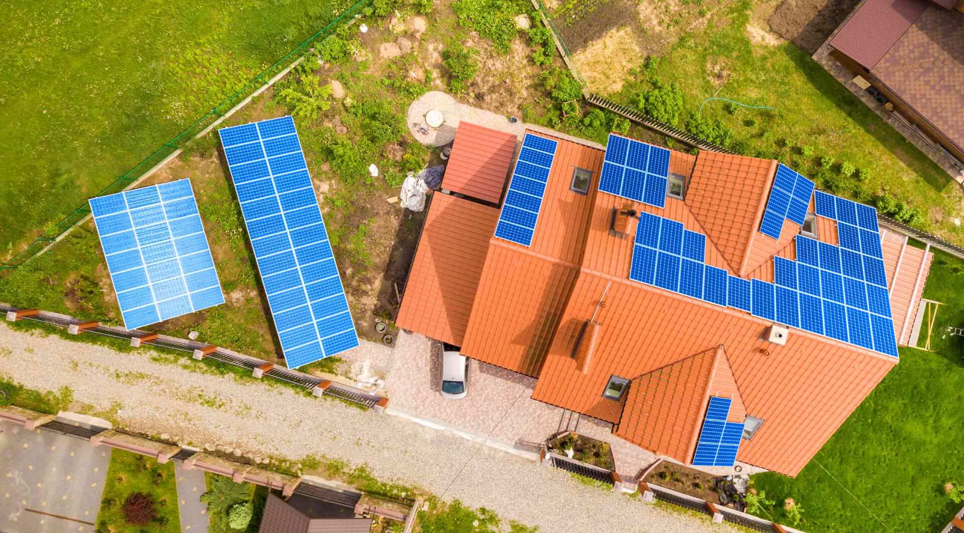 Aerial view of home with solar panels.